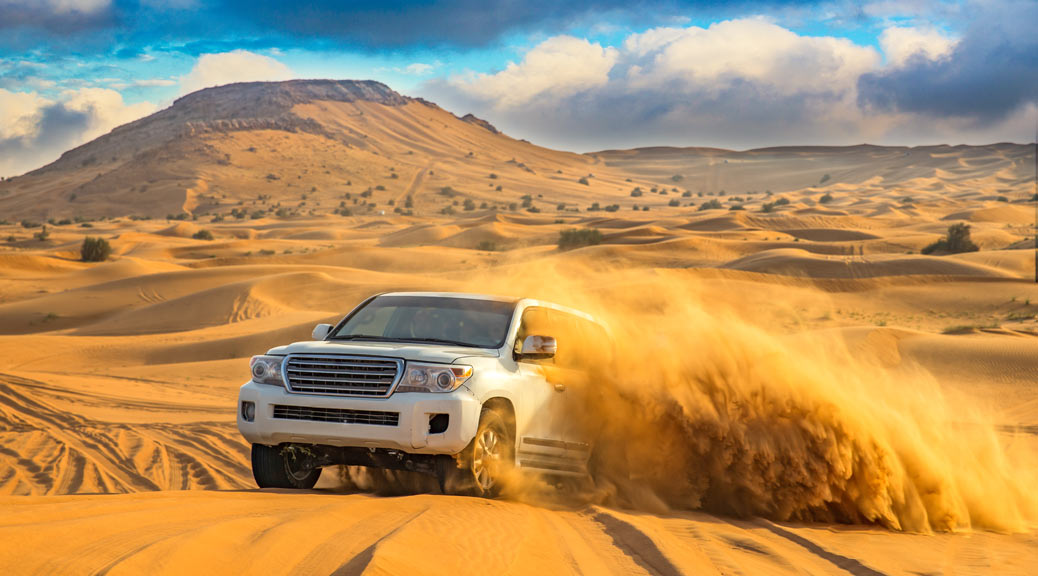 Four wheel Off-road vehicle driving in the desert.