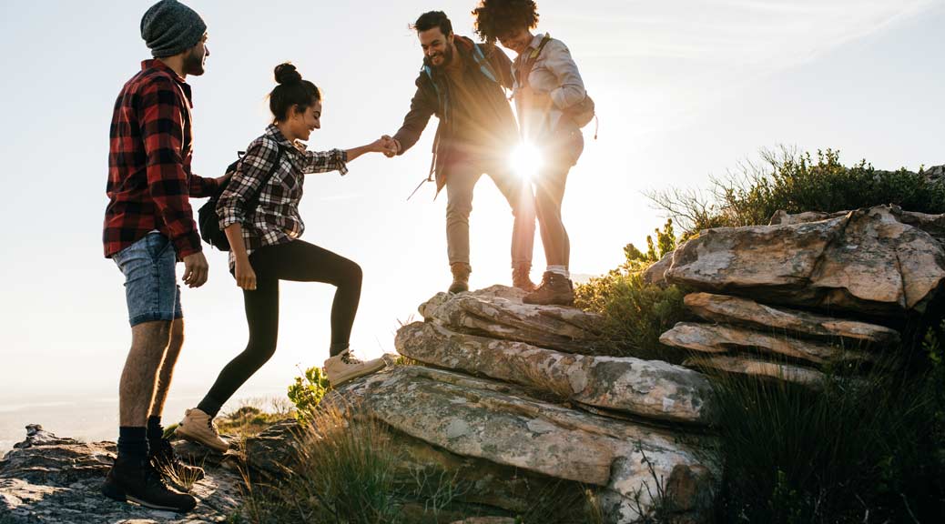 Group of friends hiking in mountain