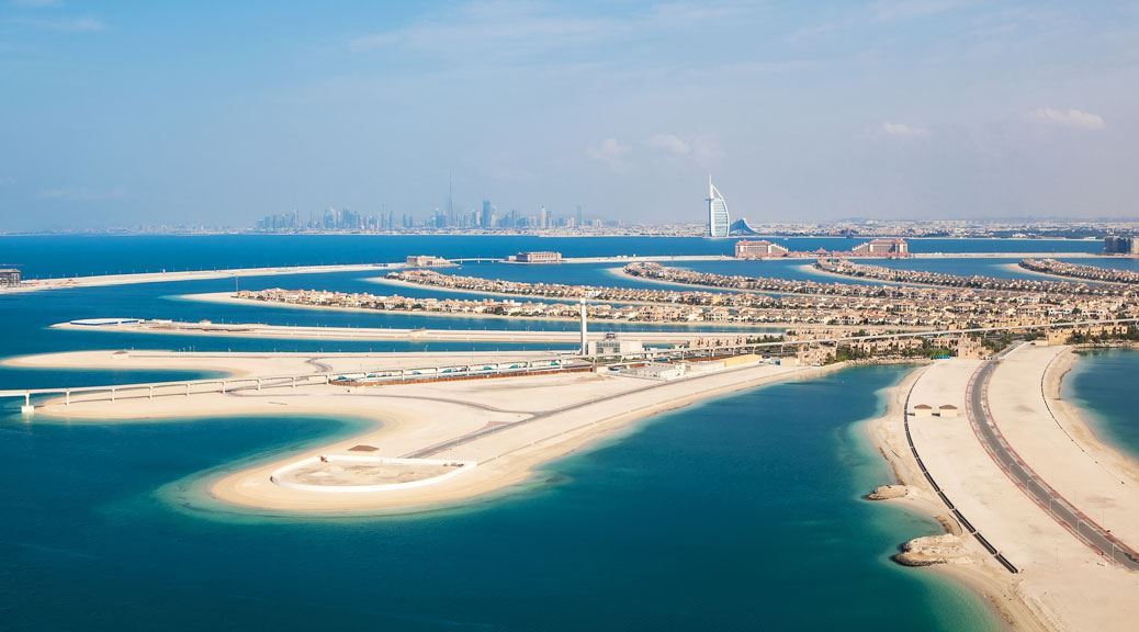 Palm jumeriah beach dubai city and burj al arab in the background seen from the sky