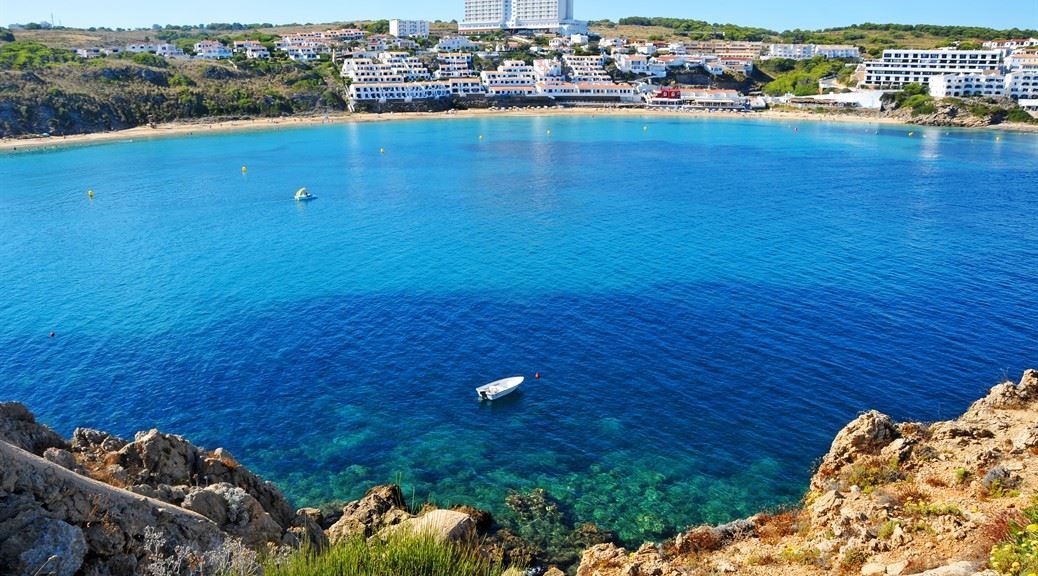 Clear water of arenal den castell beach seen from far