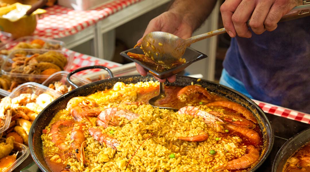 Paella preparation, street market stand near Barcelona Cathedral square