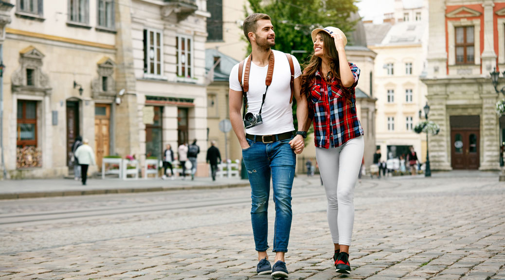 Beautiful Tourist Couple In Love Walking On Street Together.