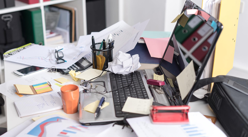 Messy and cluttered office desk