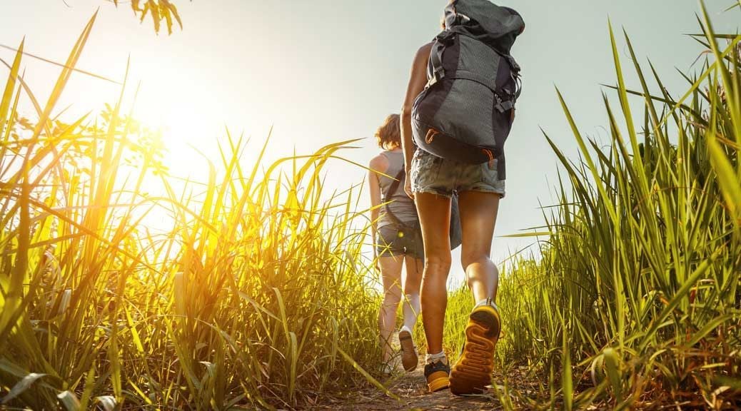 backpacker is exploring by walking